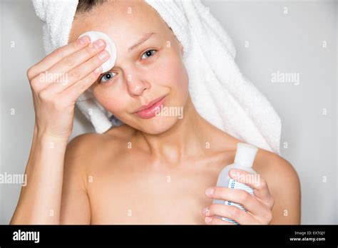 Beautiful Brunette Woman Removing Makeup From Her Face Stock Photo Alamy