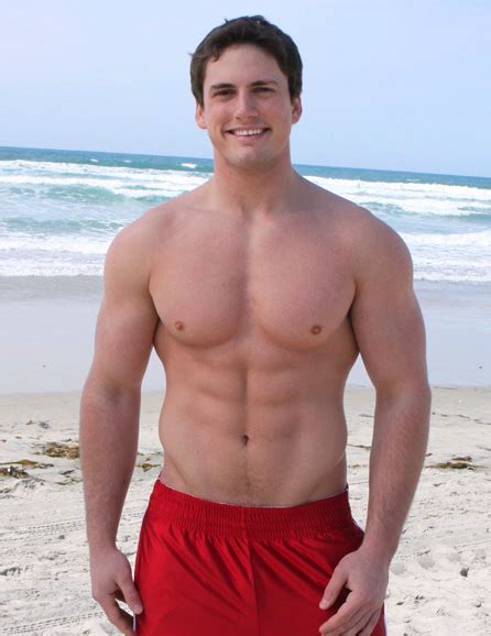 Muscle Jocks Beach Hunk In Red Shorts