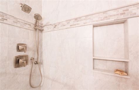 The Shower Head And Hand Shower Are Connected To The Wall In This