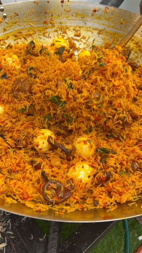 A Large Pan Filled With Food On Top Of A Stove