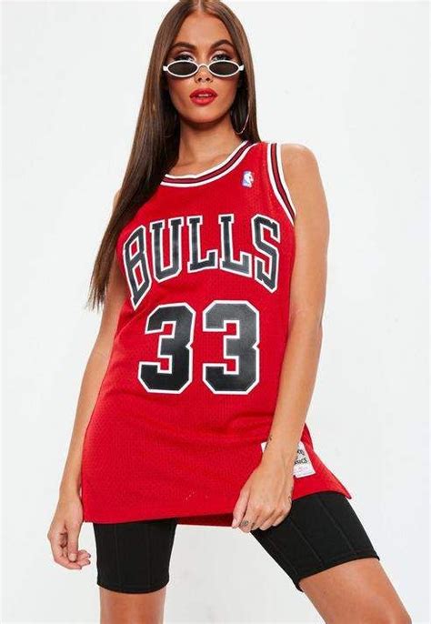 A Woman In A Bulls Jersey Posing For The Camera