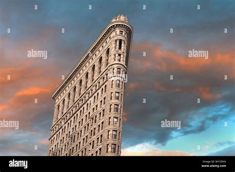Orange Clouds Of Sunset Behind Flatiron Building New York City Stock
