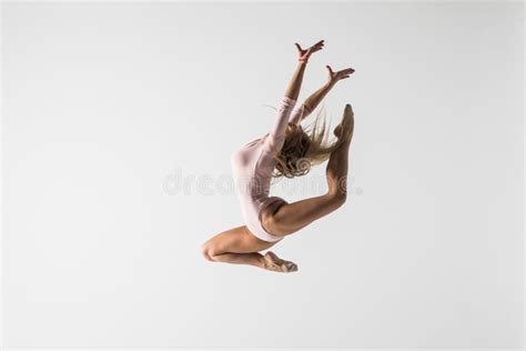 Young Modern Gymnastics Woman Jumping On White Background Stock Image
