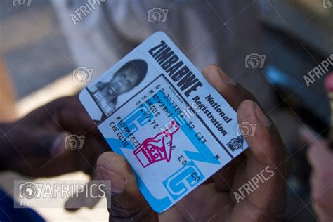 AFRIPICS A Zimbabwean Man Holding A Zimbabwe National Registration