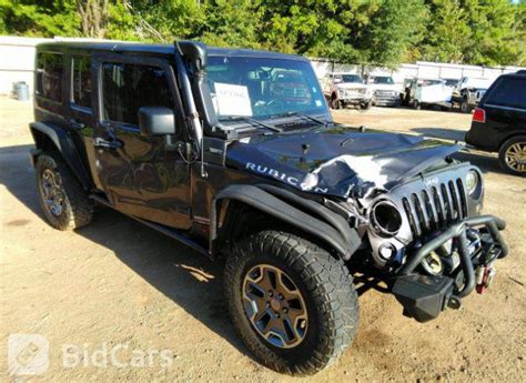 2014 Jeep Wrangler Unlimited Rubicon 1C4HJWFG7EL256844 Bid History