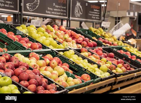 Apples In A Supermarket On Showcases In Boxes Fruits In A Store For