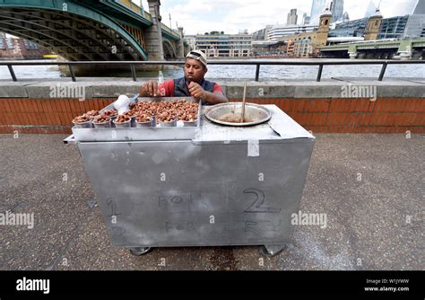 London England UK Man Selling Caramelized Nuts On The South Bank