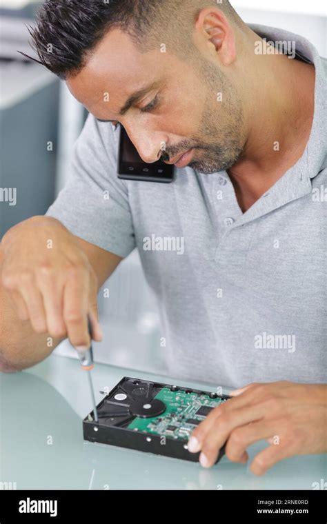 Proffesional Repairman Repairing Broken Hard Drive Stock Photo Alamy