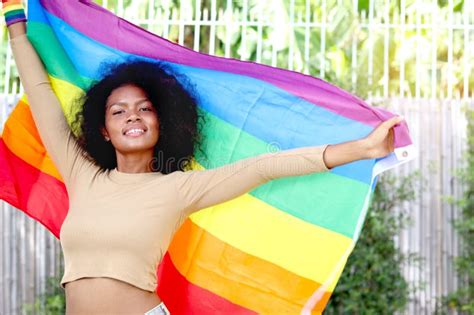 Happy Smiling Homosexual Lesbian African Woman With Curly Hair Holding