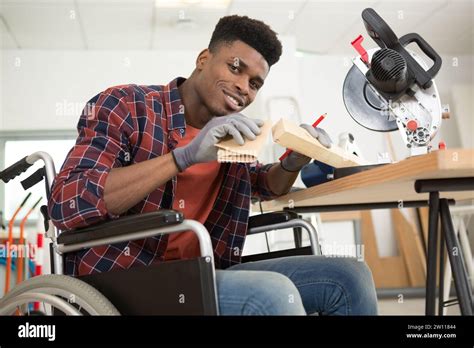 Carpenter In Wheelchair Using Circular Saw Stock Photo Alamy
