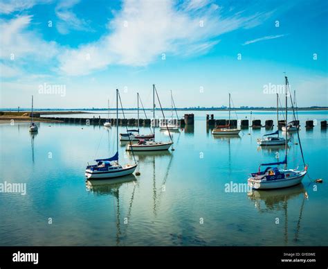 Boats Moored In Langstone Harbour Beside The Hayling Island Bridge