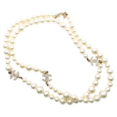 Chanel Classic Long Pearl Necklace With Cc Silver Crystal Logos At