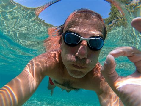 Premium Photo Portrait Of Shirtless Man Swimming In Sea