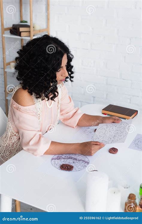 Brunette Astrologer Looking At Star Charts Stock Photo Image Of