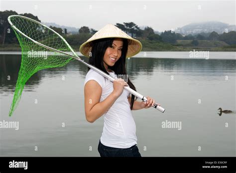 Young Asian Woman Holding A Fishing Net Stock Photo Alamy