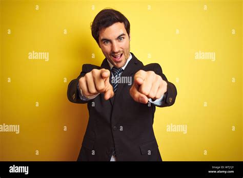 Young Handsome Businessman Wearing Suit And Tie Standing Over Isolated