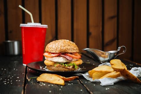 Premium Photo Big Burger Combo Menu With Potatoes And Drink