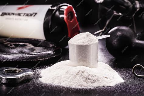 Premium Photo | Spoon with creatine whey or casein whey supplements ...
