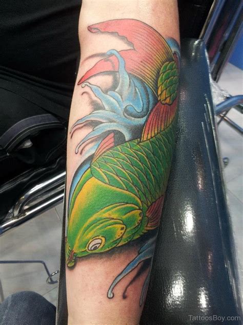 Green Fish Tattoo On Arm Tattoo Designs Tattoo Pictures