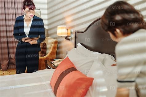 Фотография на тему Hotel manager controlling work | PressFoto