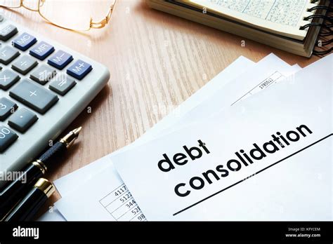 Documents With Title Debt Consolidation On An Office Table Stock Photo