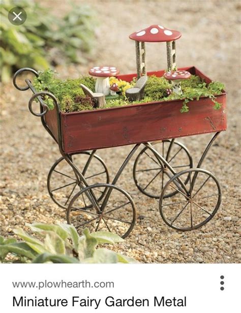 Making A Min Fairy Garden In This Wheelbarrow Fairy Garden Accessories Fairy Garden