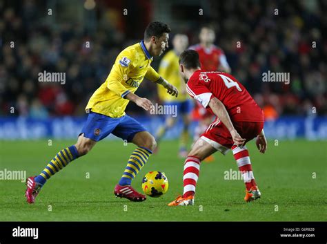 Arsenals Mesut Ozil In Yellow In Action Against Southamptons Morgan