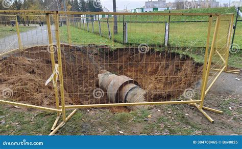 A Trench Has Been Dug In One Of The City Streets To Repair And Replace