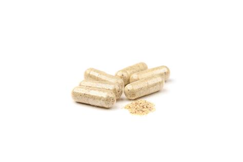 Premium Photo | Herbal capsules isolated on white