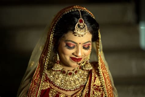 A Woman In A Red And Gold Bridal Outfit Photo Free Apparel Image On Unsplash