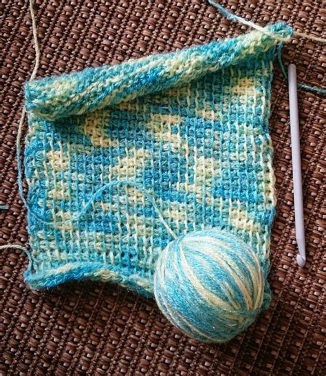 My Tunisian Simple Stitch scarf in the making.😊 | Knitted hats, Knitting, Collection box