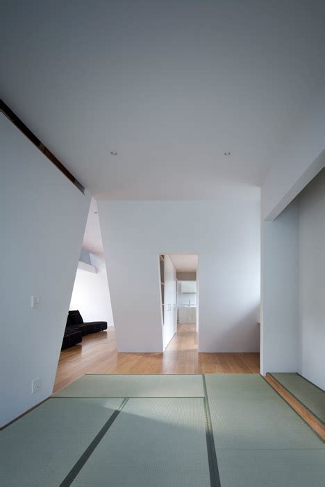 House In Japan By Spray Shelters Patios Beneath Its Wonky Roof