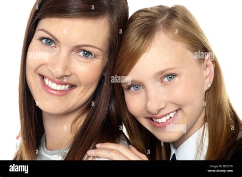 Closeup Of Mom And Daughter Flashing A Smile Bonding Love And Care