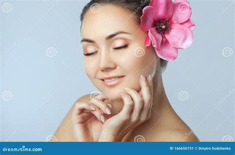 Portrait Of A Beautiful Happy Woman With Clean Skin And Nude Make Up