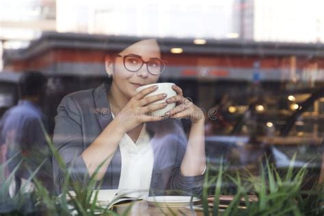 Beautiful Brunette Business Woman In White Skirt And Grey Suit Jacket Working From The Cafe She