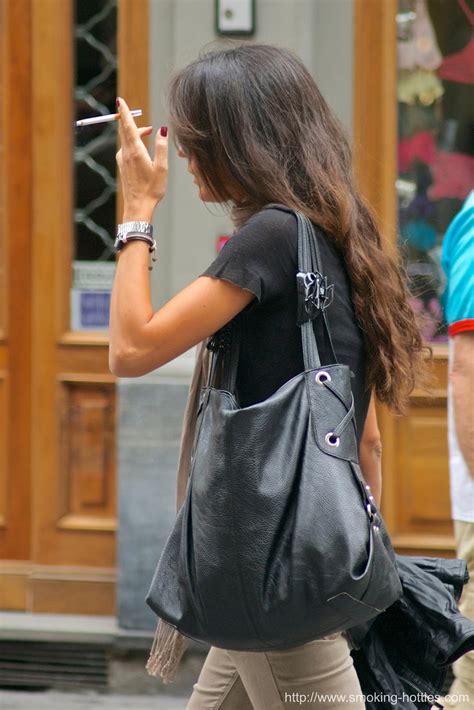 Brunette With A Large Bag Smoking Hotties