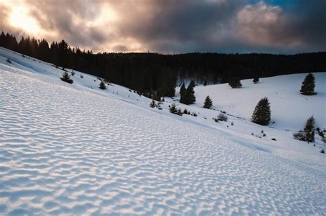 Premium Photo Sunset Over Snowy Mountains