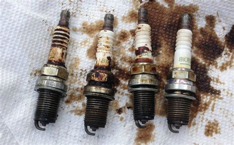 What Causes Oil To Get On Spark Plugs