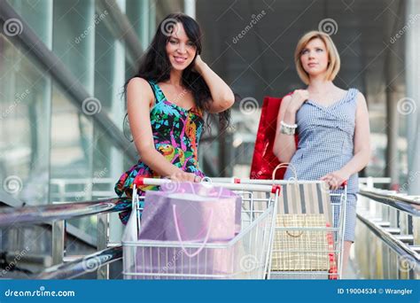 Young Fashion Women With Shopping Cart In The Mall Stock Photo Image