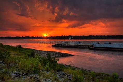 Sunset On The Mississippi River Barges Traveling The Waterway Stock