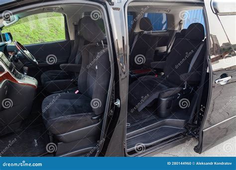 Japanese Luxury Minivan Car Interior View Through The Opened Doors With Seven Passenger Seats