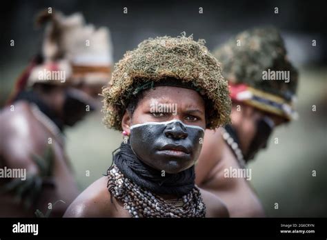 A Tribeswoman With Paint On Her Face Prepared For The Sing Sing