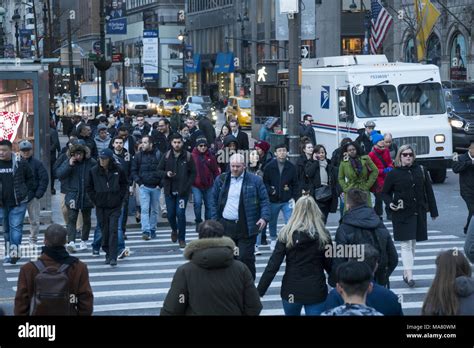 Pedestrians In The Crosswalk At The Always Busy Corner Of 5th Avenue