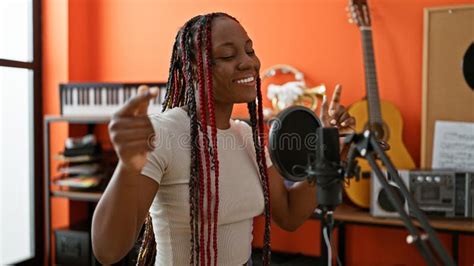 Beautiful African American Woman Confidently Belting Out Melodies In A