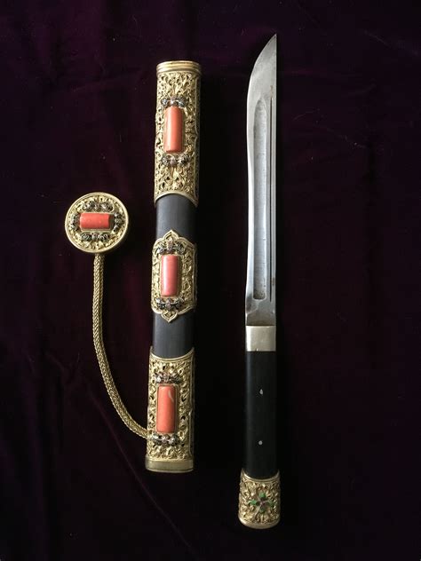 A beautiful Mongolian knife decorated with gilded silver in partial ...