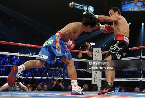 Manny Pacquiao Knocks Back Juan Manuel Marquez With A Left To The