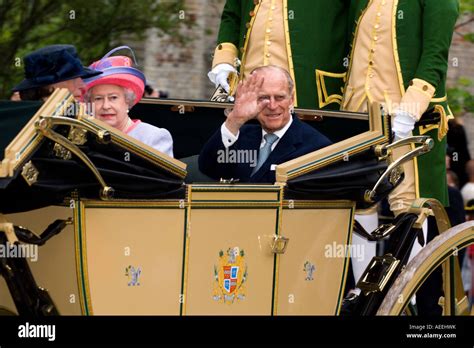 Queen Elizabeth And Prince Philip Ride In An Open Carriage In Colonial