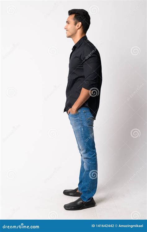 Full Body Shot Profile View Of Young Happy Indian Businessman Smiling