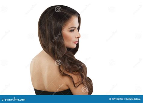 Stylish Brunette Model Woman With Long Wavy Hair And Shiny Fresh Skin Posing On White Background