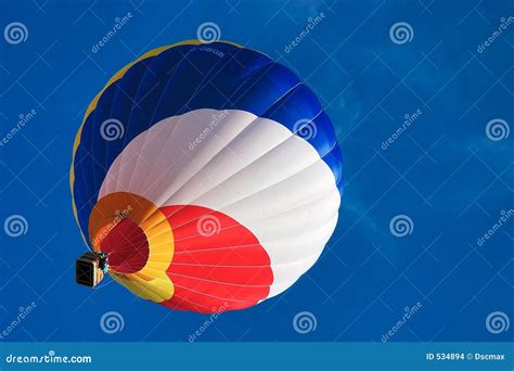 Multi Colored Hot Air Balloon On A Blue Sky Stock Photo Image Of Spiral Yellow